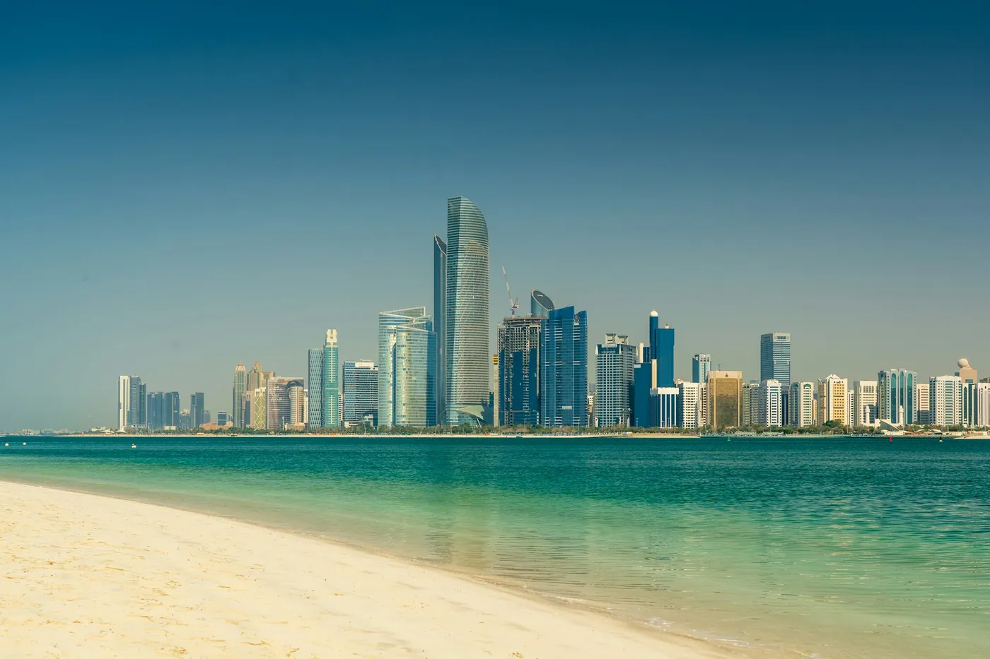 The Abu Dhabi skyline seen across the sea from the beach